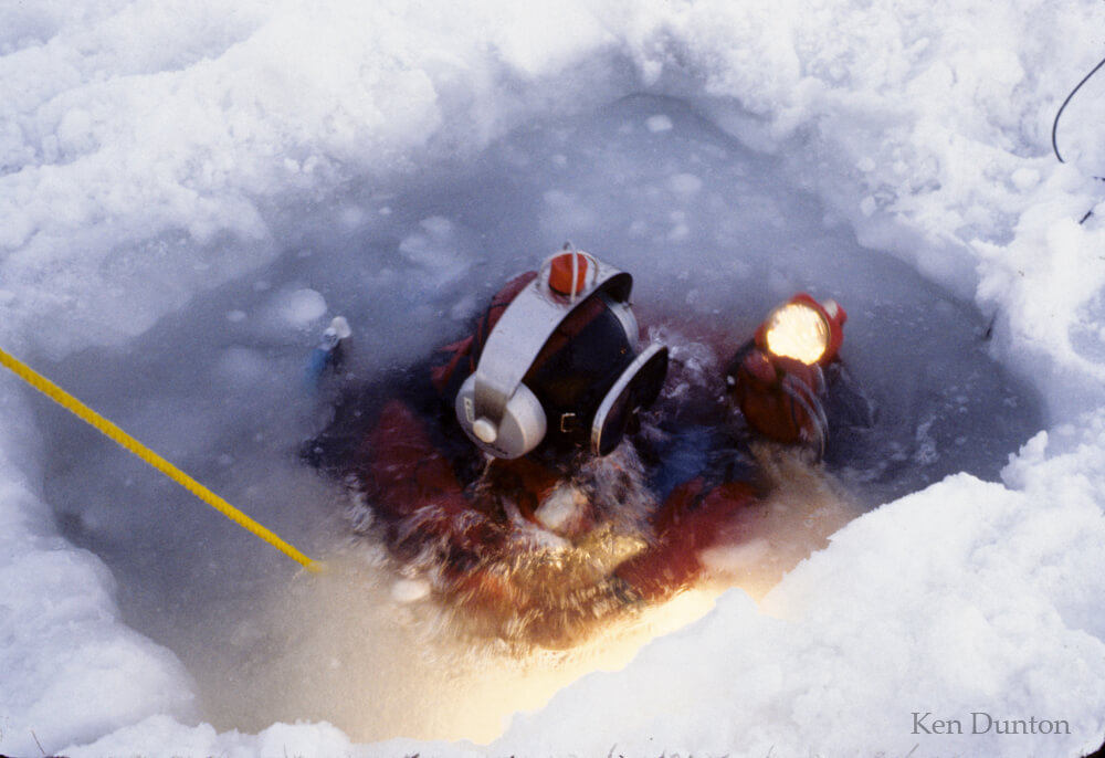Diver descending through slush ice in February 1978